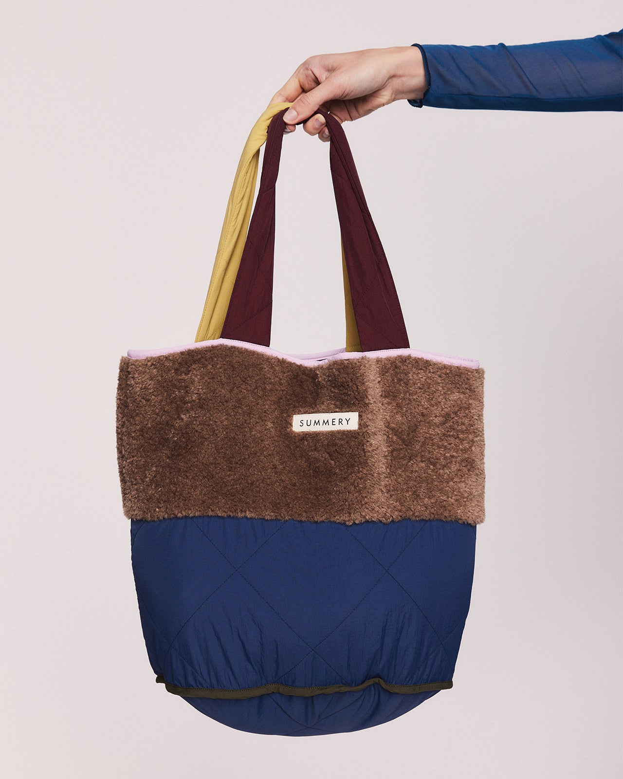 HARLOW QUILTED BUCKET TOTE IN BROWN